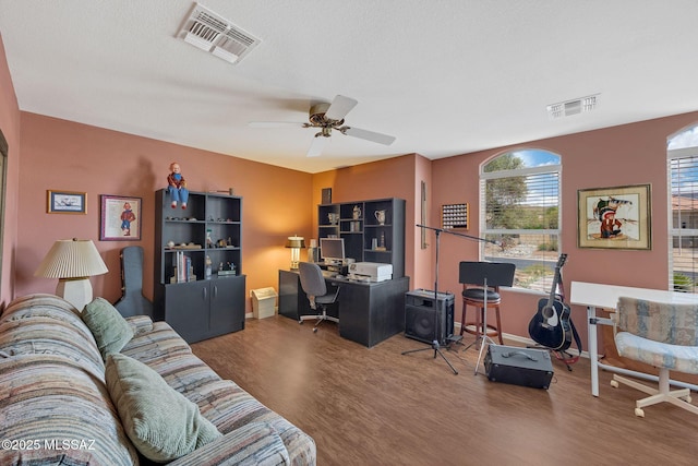 65535 E Rose Ridge Dr, Saddlebrooke, AZ 85739 - home office with wood finished floors, a ceiling fan, and baseboards