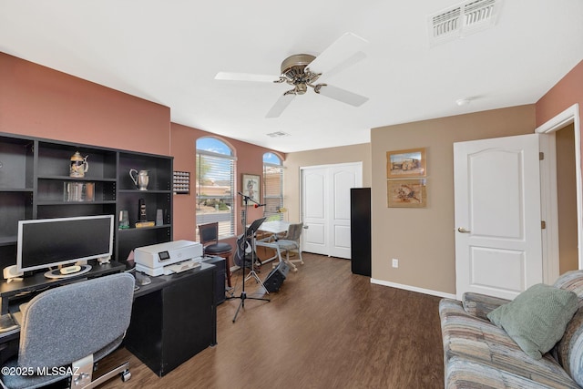 65535 E Rose Ridge Dr, Saddlebrooke, AZ 85739 - office area with dark wood-style flooring, ceiling fan, and baseboards