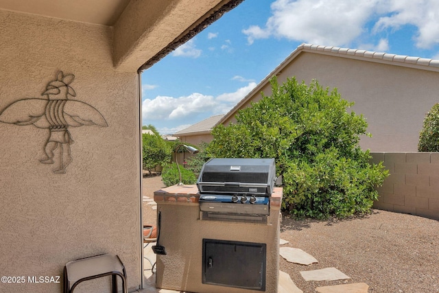 65535 E Rose Ridge Dr, Saddlebrooke, AZ 85739 - view of patio featuring grilling area