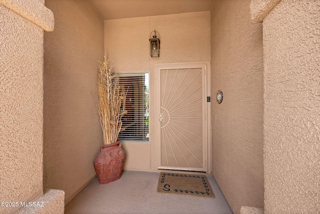 65535 E Rose Ridge Dr, Saddlebrooke, AZ 85739 - doorway to property featuring stucco siding