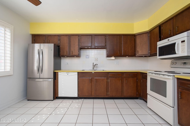 4736 N Calle Lampara, Tucson, AZ 85718 - kitchen with white appliances, a sink, light countertops, and healthy amount of natural light