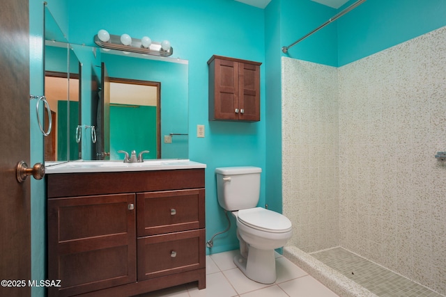 4736 N Calle Lampara, Tucson, AZ 85718 - bathroom featuring a tile shower, toilet, vanity, and tile patterned floors