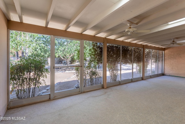 4736 N Calle Lampara, Tucson, AZ 85718 - unfurnished sunroom featuring a ceiling fan, carpet, plenty of natural light, and beam ceiling