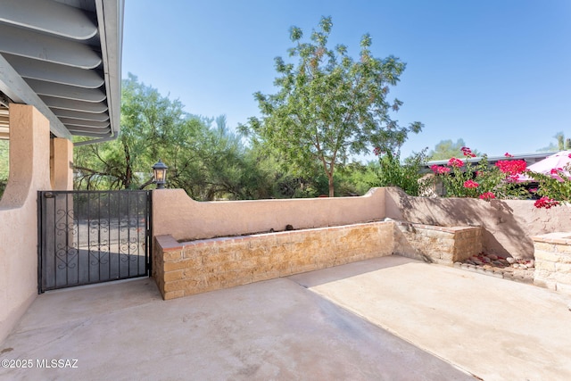 4736 N Calle Lampara, Tucson, AZ 85718 - view of patio / terrace with a gate