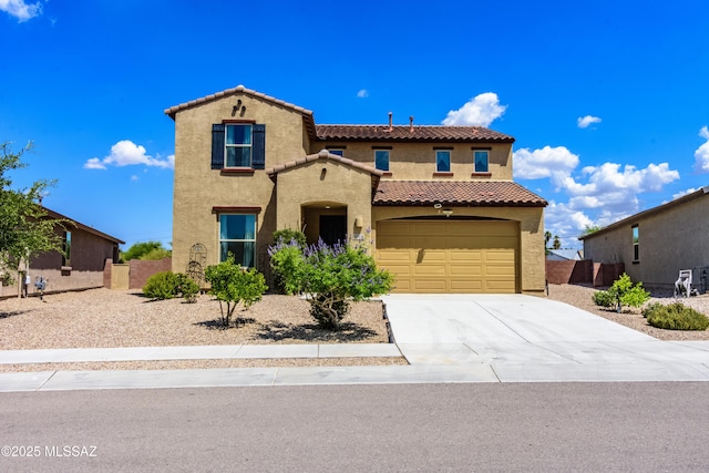 9569 N Sage Vista Ct, Tucson, AZ 85742 - mediterranean / spanish house with a tiled roof, stucco siding, concrete driveway, and an attached garage