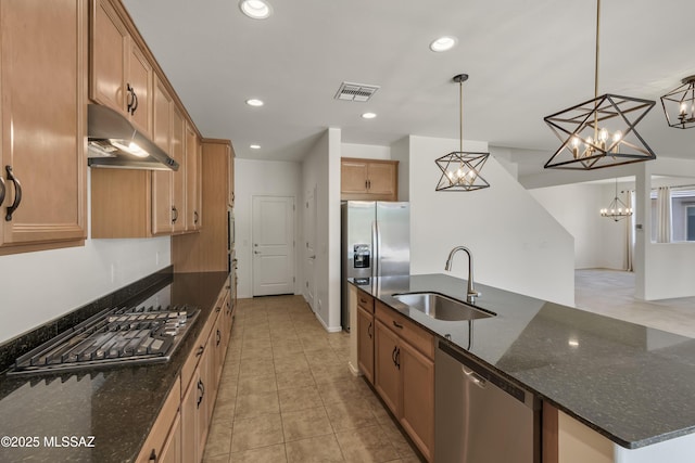 9569 N Sage Vista Ct, Tucson, AZ 85742 - kitchen with appliances with stainless steel finishes, a sink, range hood, a chandelier, and light tile patterned floors