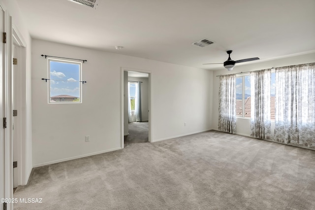 9569 N Sage Vista Ct, Tucson, AZ 85742 - empty room featuring carpet flooring, ceiling fan, and baseboards