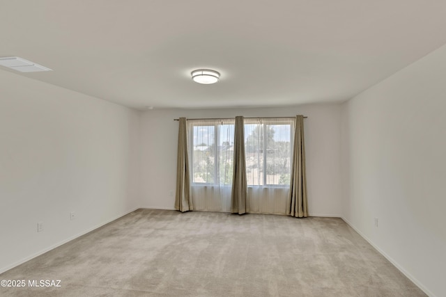 9569 N Sage Vista Ct, Tucson, AZ 85742 - unfurnished room featuring light colored carpet and baseboards