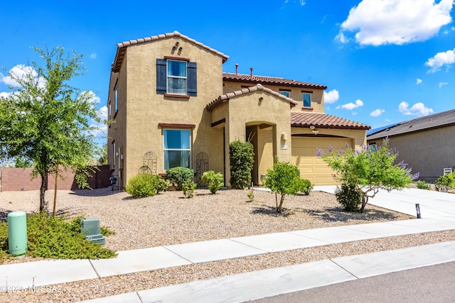 9569 N Sage Vista Ct, Tucson, AZ 85742 - mediterranean / spanish-style house with a tile roof, stucco siding, an attached garage, and concrete driveway