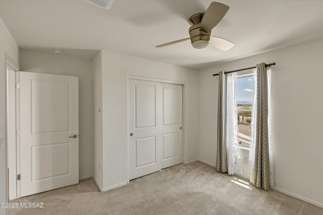 9569 N Sage Vista Ct, Tucson, AZ 85742 - unfurnished bedroom with carpet, baseboards, and a closet