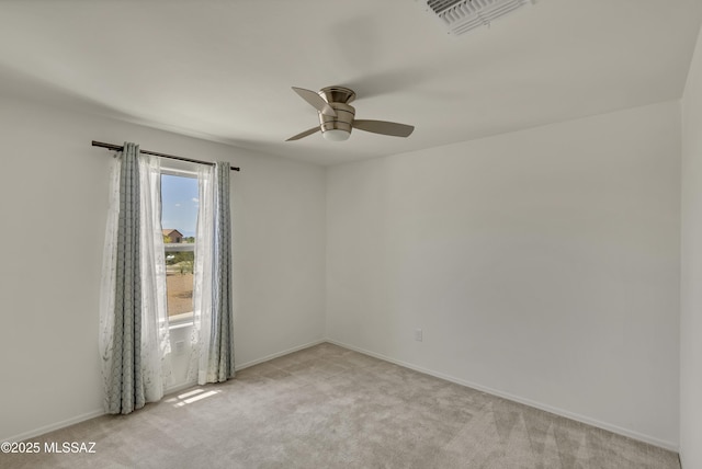 9569 N Sage Vista Ct, Tucson, AZ 85742 - unfurnished room featuring ceiling fan, light carpet, and baseboards