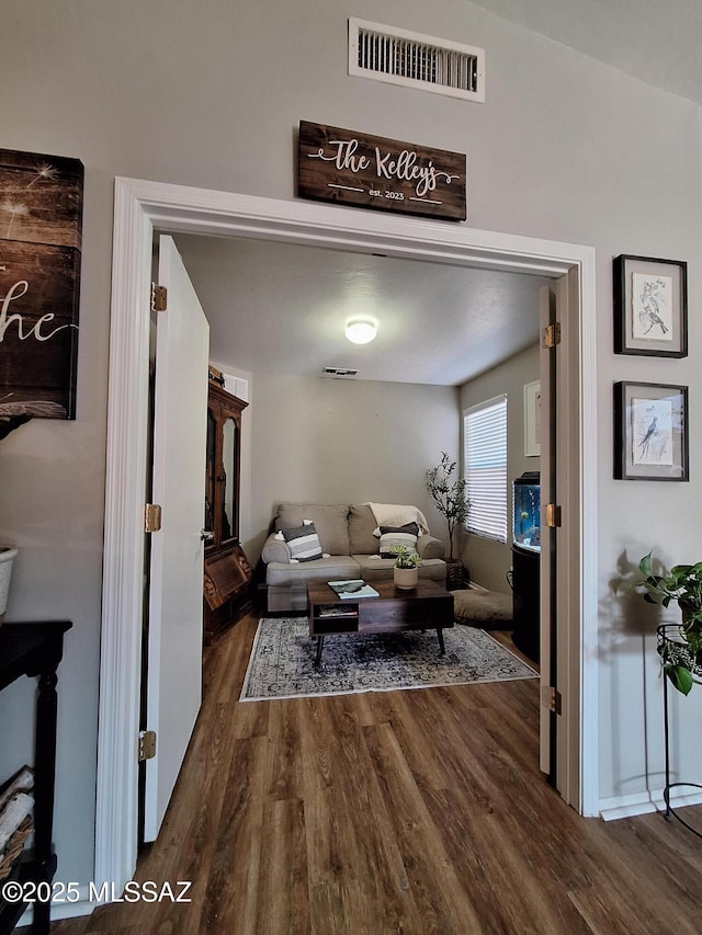 4396 S Valley Rd, Tucson, AZ 85714 - living room with dark wood-style flooring and baseboards