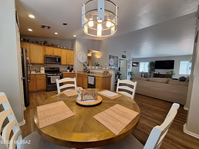 4396 S Valley Rd, Tucson, AZ 85714 - dining area featuring wood finished floors, recessed lighting, and a chandelier