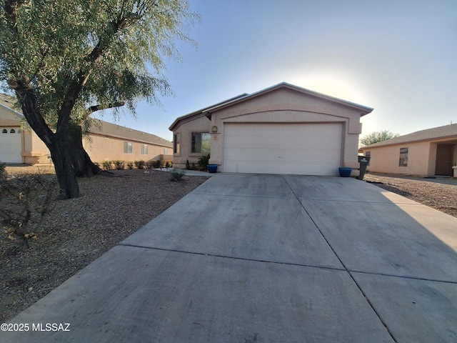 4396 S Valley Rd, Tucson, AZ 85714 - view of front of house featuring concrete driveway and a garage