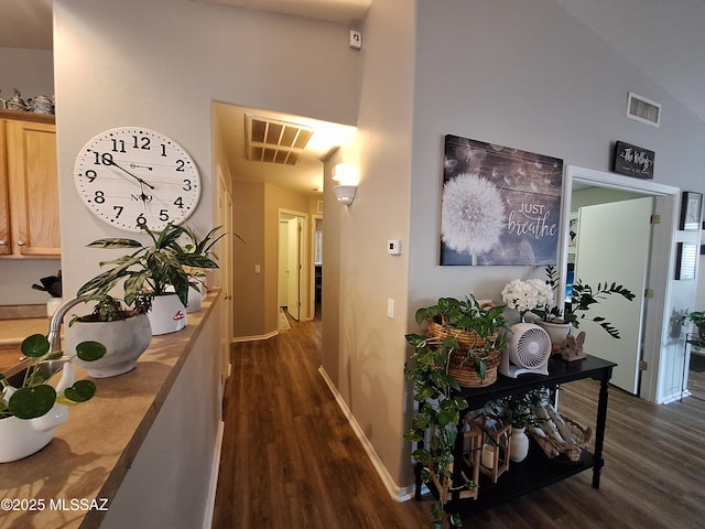 4396 S Valley Rd, Tucson, AZ 85714 - hall with dark wood finished floors, a high ceiling, and baseboards