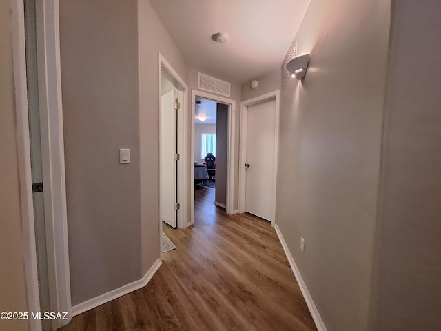 4396 S Valley Rd, Tucson, AZ 85714 - corridor with wood finished floors and baseboards
