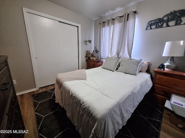 4396 S Valley Rd, Tucson, AZ 85714 - bedroom featuring wood finished floors, a closet, and baseboards