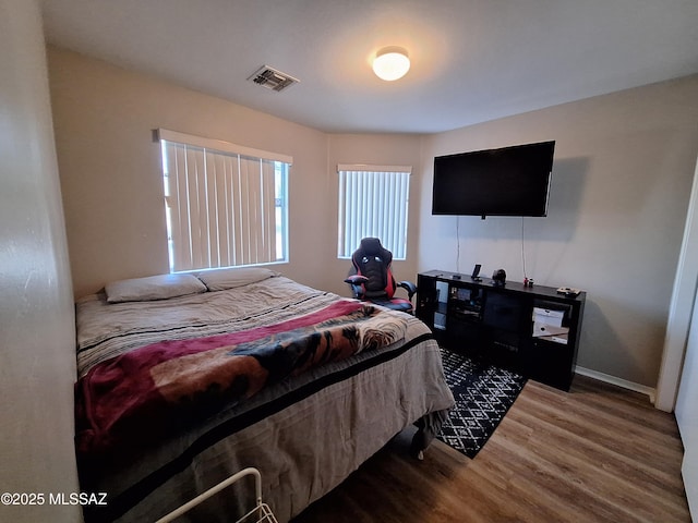 4396 S Valley Rd, Tucson, AZ 85714 - bedroom featuring wood finished floors and baseboards