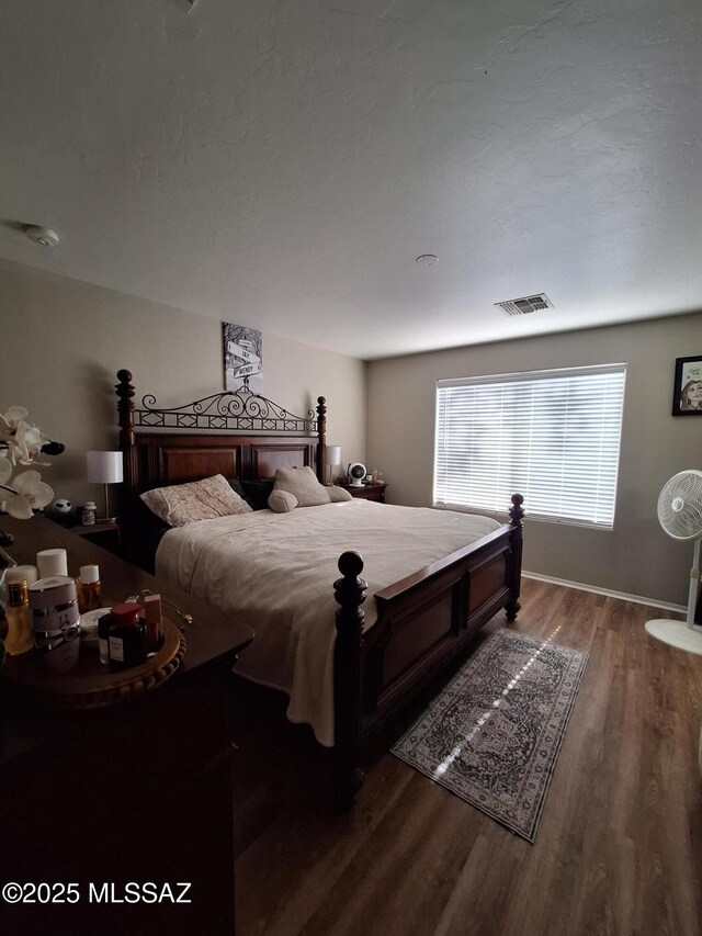 4396 S Valley Rd, Tucson, AZ 85714 - bedroom with wood finished floors and baseboards
