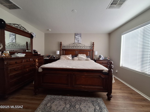 4396 S Valley Rd, Tucson, AZ 85714 - bedroom featuring dark wood-style flooring and baseboards