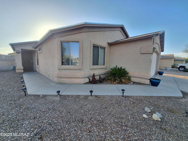 4396 S Valley Rd, Tucson, AZ 85714 - view of side of property featuring stucco siding