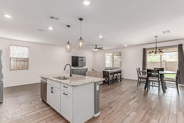 16800 S Paseo Las Vigas, Sahuarita, AZ 85629 - kitchen with a sink, stainless steel appliances, light wood-style floors, ceiling fan, and recessed lighting