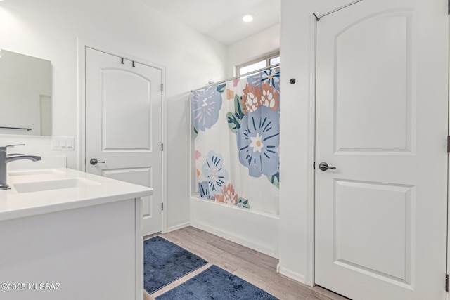 16800 S Paseo Las Vigas, Sahuarita, AZ 85629 - bathroom featuring double vanity, wood finished floors, and shower / bath combination with curtain