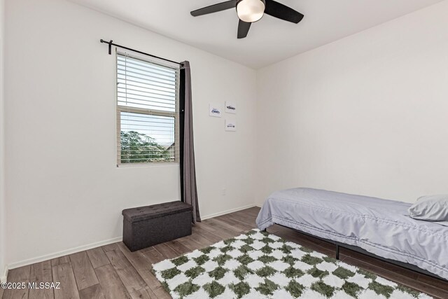 16800 S Paseo Las Vigas, Sahuarita, AZ 85629 - bedroom featuring wood finished floors, baseboards, and a ceiling fan
