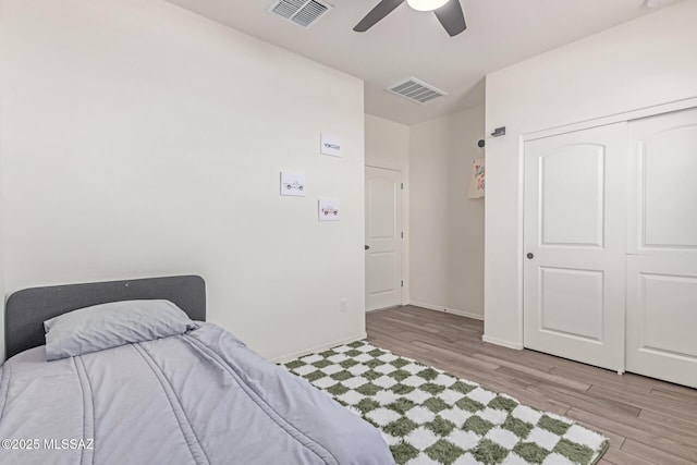 16800 S Paseo Las Vigas, Sahuarita, AZ 85629 - bedroom with wood finished floors, baseboards, ceiling fan, and a closet