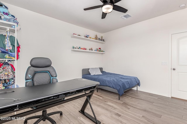 16800 S Paseo Las Vigas, Sahuarita, AZ 85629 - bedroom featuring light wood-style floors, a desk, and ceiling fan