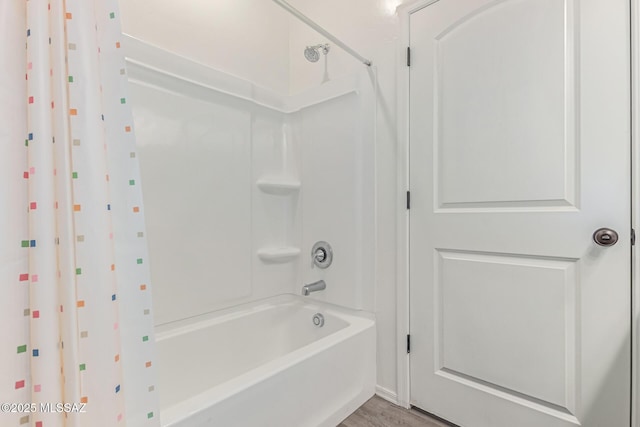 16800 S Paseo Las Vigas, Sahuarita, AZ 85629 - bathroom with shower / bath combo and wood finished floors