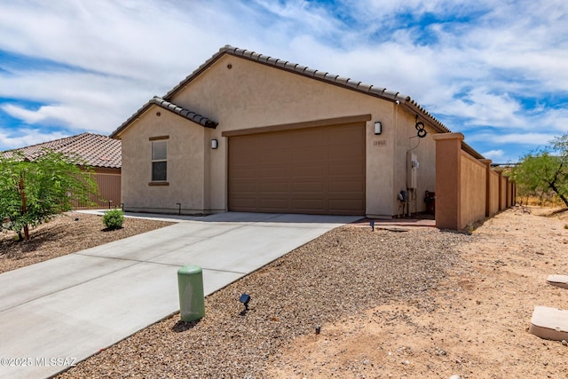 16800 S Paseo Las Vigas, Sahuarita, AZ 85629 - mediterranean / spanish home featuring concrete driveway, a garage, stucco siding, and a tiled roof