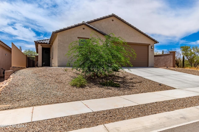 16800 S Paseo Las Vigas, Sahuarita, AZ 85629 - mediterranean / spanish-style house featuring driveway, an attached garage, stucco siding, and a tile roof