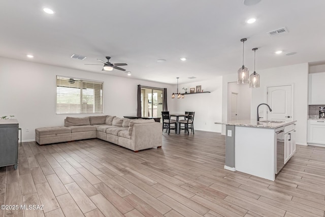 16800 S Paseo Las Vigas, Sahuarita, AZ 85629 - living room with ceiling fan, light wood-style flooring, recessed lighting, and baseboards