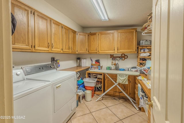5457 S 13th Ave, Tucson, AZ 85706 - washroom featuring cabinet space, independent washer and dryer, light tile patterned floors, and a textured ceiling