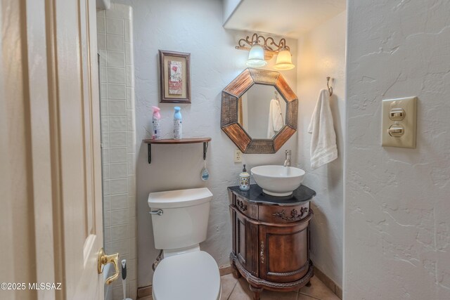 5457 S 13th Ave, Tucson, AZ 85706 - bathroom featuring toilet, vanity, tile patterned floors, and baseboards