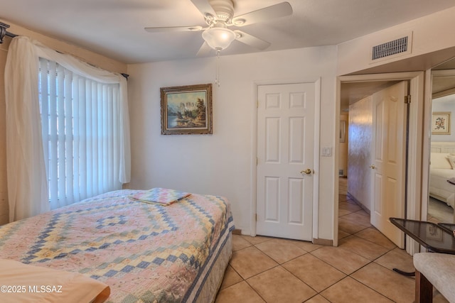 5457 S 13th Ave, Tucson, AZ 85706 - bedroom with light tile patterned floors and a ceiling fan