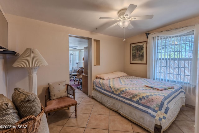 5457 S 13th Ave, Tucson, AZ 85706 - bedroom featuring light tile patterned floors and ceiling fan