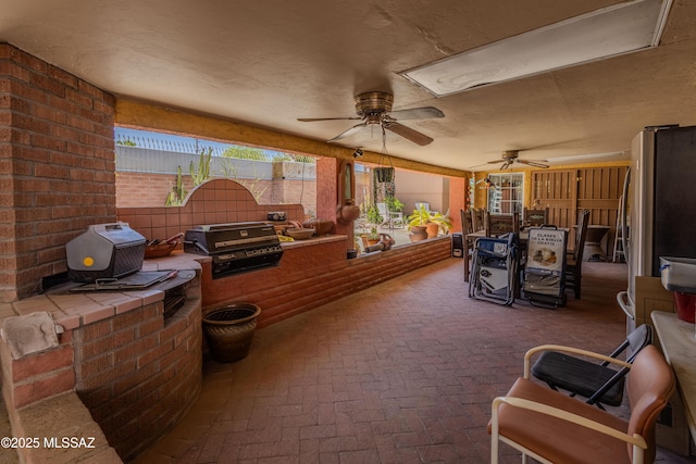 5457 S 13th Ave, Tucson, AZ 85706 - fenced backyard with ceiling fan and a patio area