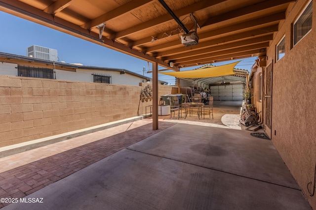 5457 S 13th Ave, Tucson, AZ 85706 - fenced backyard featuring a patio and cooling unit