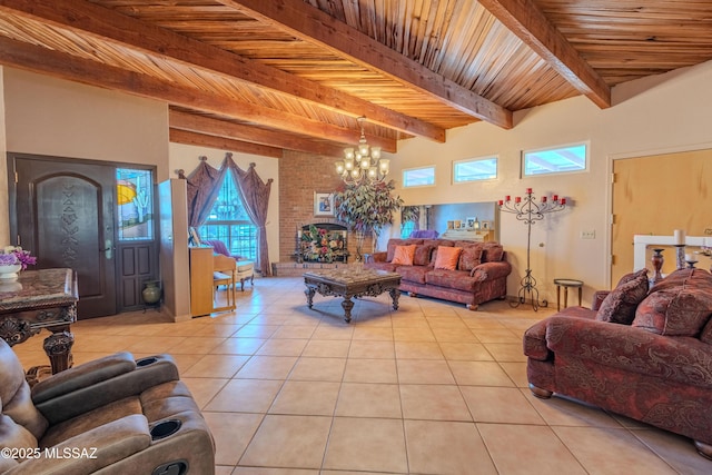 5457 S 13th Ave, Tucson, AZ 85706 - living room featuring light tile patterned floors, a chandelier, and wood ceiling with exposed beams