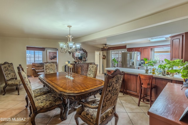 5457 S 13th Ave, Tucson, AZ 85706 - dining area featuring a chandelier and light tile patterned floors
