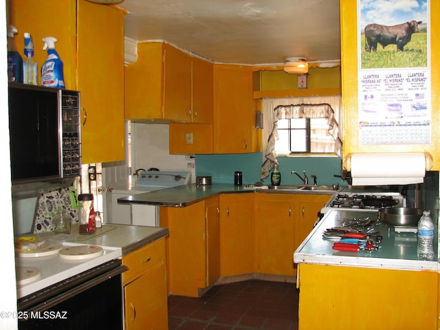 277 N Bowie Ave, Willcox, AZ 85643 - kitchen featuring a sink, range with electric cooktop, and dark tile patterned flooring