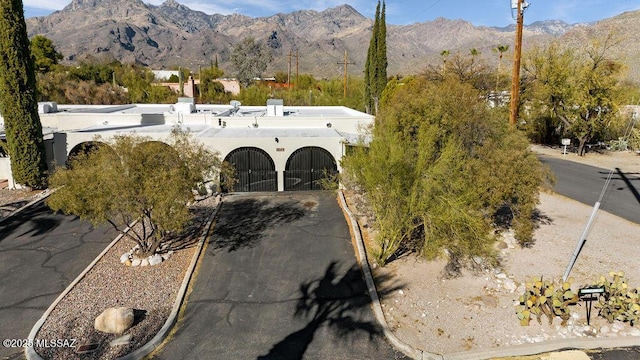 8069 E Cameo Cir, Tucson, AZ 85750 - view of front facade with a mountain view and stucco siding