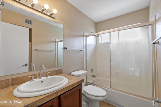 6783 W Alegria Dr, Tucson, AZ 85743 - full bathroom with vanity, toilet, and shower / bath combination with glass door