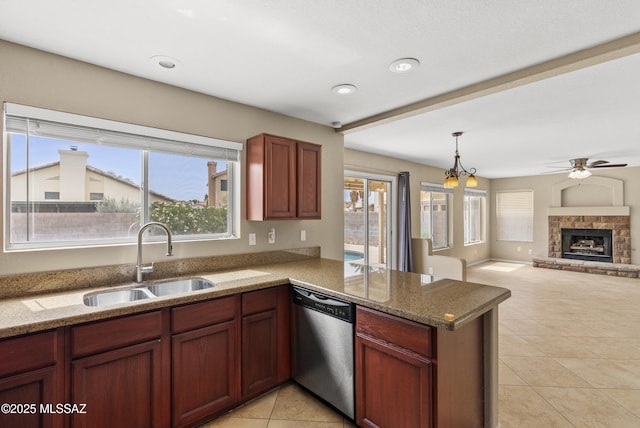 6783 W Alegria Dr, Tucson, AZ 85743 - kitchen featuring stainless steel dishwasher, a sink, a peninsula, light tile patterned floors, and a ceiling fan