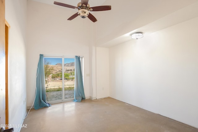 2 Sunset Dr, Elgin, AZ 85611 - empty room with concrete floors, ceiling fan, and a towering ceiling