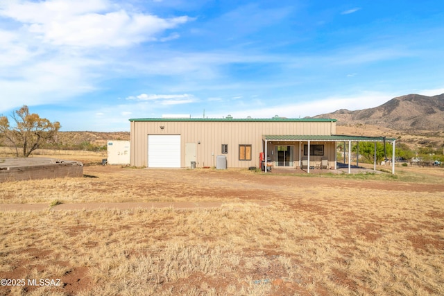 2 Sunset Dr, Elgin, AZ 85611 - back of property featuring a mountain view, board and batten siding, an outbuilding, and a detached garage