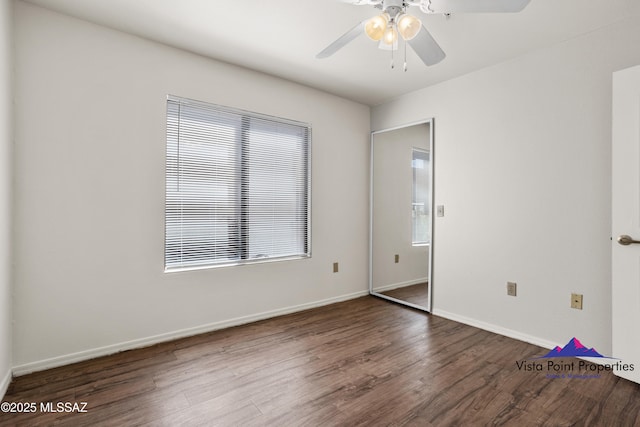 5751 N Kolb Rd # 22103, Tucson, AZ 85750 - spare room with wood finished floors, a ceiling fan, and baseboards