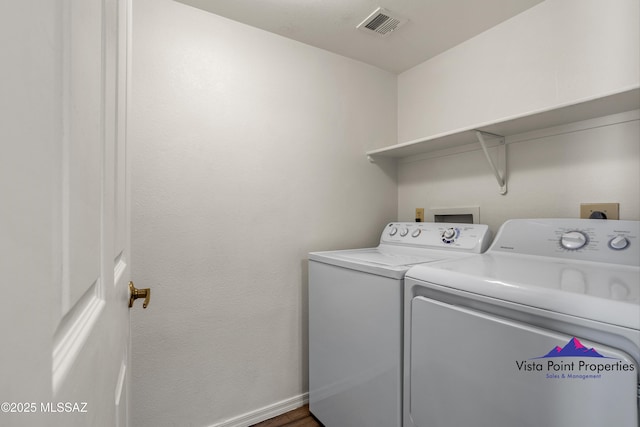 5751 N Kolb Rd # 22103, Tucson, AZ 85750 - laundry area with washing machine and dryer, baseboards, and wood finished floors